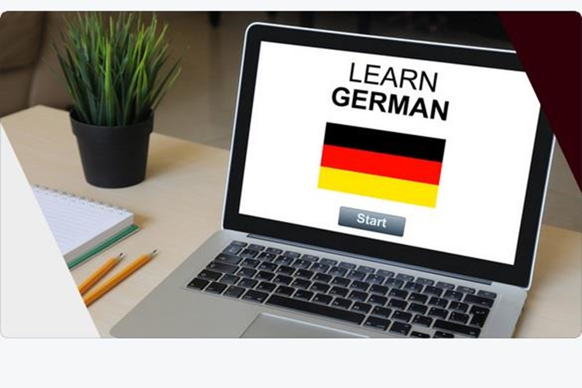  Laptop mit Schriftzug Learn German und darunter die Deutsche Flagge und unten die Starttaste 